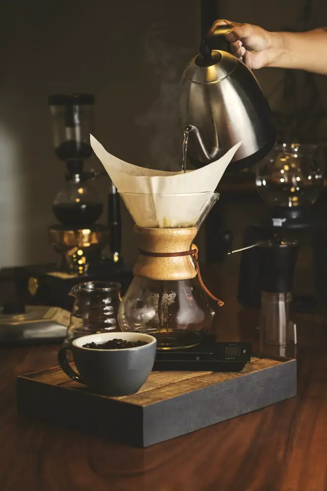 Coffee being hand-poured through a paper filter