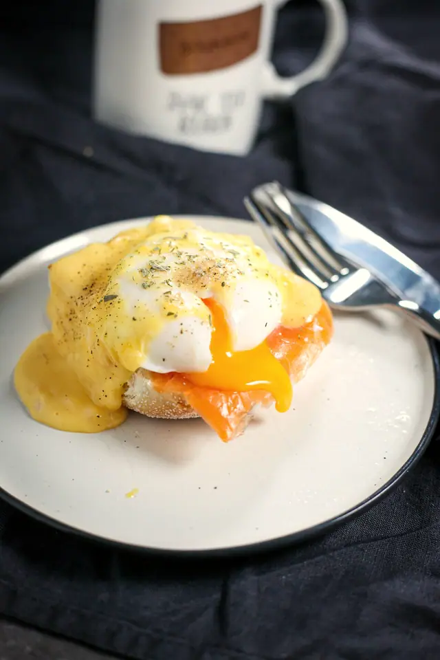 A croissant benedict with poached eggs