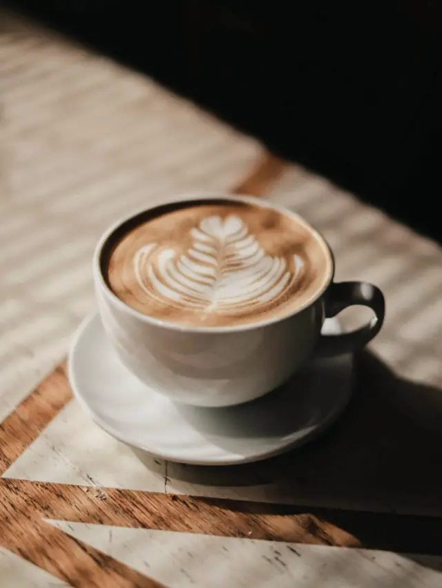 Latte art in a cup on a saucer